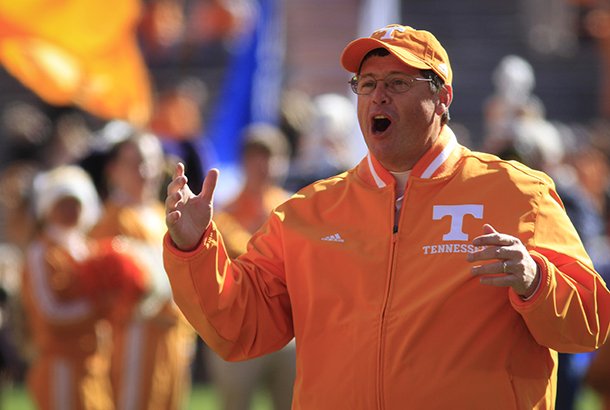 tennessee-offensive-coordinator-jim-chaney-serving-as-interim-head-coach-since-derek-dooley-was-fired-after-the-last-game-cheers-for-the-senior-class-players-as-they-take-the-field-to-play-kentucky-in-an-ncaa-college-football-game-saturday-nov-24-2012-in-knoxville-tenn-the-vols-won-37-17-the-vols-won-37-17-ap-photochattanooga-times-free-press-dan-henry