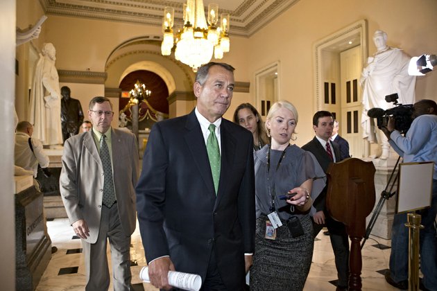 house-speaker-john-boehner-of-ohio-walks-to-the-house-floor-to-deliver-remarks-about-negotiations-with-president-barack-obama-on-the-fiscal-cliff-on-tuesday-dec-11-2012-on-capitol-hill-in-washington