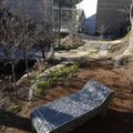 Chaise Gabion, a stainless steel and stones sculpture created in 2009 by Celeste Roberge, is located...