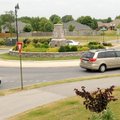 Drivers circle the one-lane roundabout May 25 at the intersection of John DeShields Boulevard and Mo...