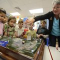 Sherrie Eoff, right, youth gardening chairman with the Garden Club of Rogers, demonstrates the effec...