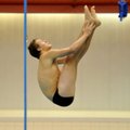 Tyler Rousey, a Bentonville diver, works on his form during practice Tuesday at the University of Ar...