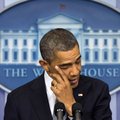 President Barack Obama wipes his eye as he talks about the Connecticut elementary school shooting, F...