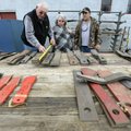 James Miles of Neosho, Mo., measure brush hog blades as his wife, Lahoma, and Bobby Luttrell of Faye...