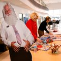 Jane Donner, right, of Siloam Springs and Kathy Turner of Bentonville work Friday wrapping gifts at ...