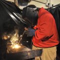 Fayetteville High student Joseph Davis makes a weld Wednesday as he and other students demonstrate t...
