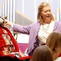 Kristi Button talks to children about Charity the Church Mouse during the Hanging of the Greens serv...