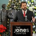 Ryan Hale, program officer at the Walton Family Foundation, speaks Friday during a news conference a...