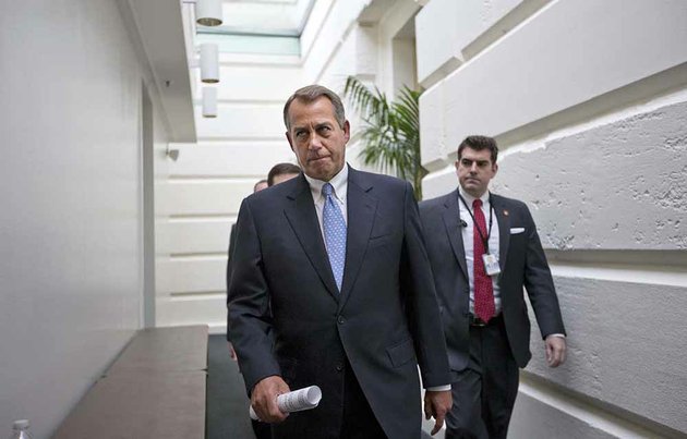file-in-this-dec-5-2012-file-photo-house-speaker-john-boehner-of-ohio-walks-to-a-closed-door-republican-strategy-session-wednesday-dec-5-2012-on-capitol-hill-in-washington-boehner-has-been-caught-up-in-a-monumental-struggle-over-taxes-and-spending-aimed-at-keeping-the-country-from-taking-a-yearend-dive-over-the-fiscal-cliff-president-barack-obama-is-tugging-boehner-one-way-in-pursuit-of-a-budget-deal-while-conservatives-yank-the-other-way-some-howling-that-the-speaker-already-is-going-wobbly-on-them-and-turning-vindictive-against-those-in-his-party-who-dare-disagree