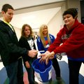 Joe Adams, from left, Kelsey Thomas and Kennedy Cottrell, all seniors and Deca members, hold out a b...