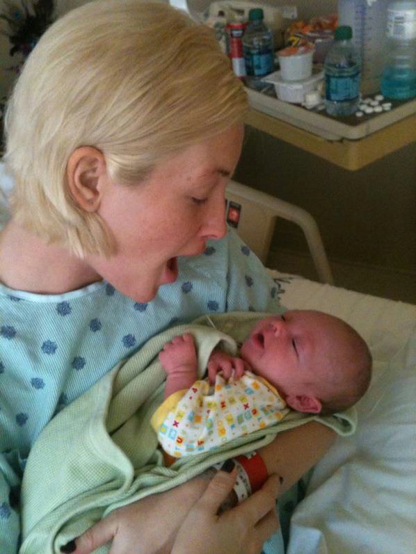 Leslie Harris cradles her newborn ...