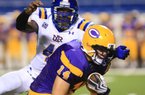 Arkansas Democrat-Gazette/STATON BREIDENTHAL
9/8/10
North Little Rock's Martell Spaight (left) tackles Catholic's Scott Scruggs during the second quarter of their game Thursday night at War Memorial Stadium.
