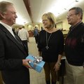 Bentonville District Judge John Skaggs, left, talks Wednesday to longtime friends Mike and Jackie Ri...