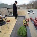Michael Poore, superintendent of Bentonville Schools, listens Wednesday from the roof of the School ...