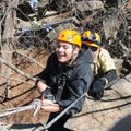Jonathan Barrientos, a Rogers High School student with cerebral palsy, rappels down a cliff with out...