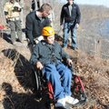Flannigan rolls Jonathan Barrientos to the edge of a cliff Dec. 12 so he can rappel 50 feet to the b...