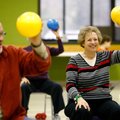 Jutta Shipley (left) of Springdale exercises Wednesday with the class. 
