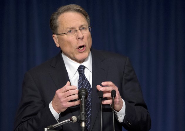 the-national-rifle-association-executive-vice-president-wayne-lapierre-gestures-during-a-news-conference-in-response-to-the-connecticut-school-shooting-on-friday-dec-21-2012-in-washington-the-nations-largest-gun-rights-lobby-is-calling-for-armed-police-officers-to-be-posted-in-every-american-school-to-stop-the-next-killer-waiting-in-the-wings