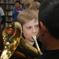 Robert Townsend, a sixth-grader, plays a note Thursday in his role as Titanic band leader during the...