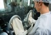 A lab technician works with sterile products during drug manufacturing at a plant owned by Teva Pharmaceuticals Industries Ltd.’s factory in Godollo, Hungary, in October. Teva is the world’s largest maker of generic drugs. 