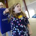 Avery Pick, 9, center, throws an elbow into a striking dummy Thursday held by Benton County Sheriff’...