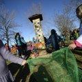 Lizzy Marquess, 7, left, and Noelle Wilkinson, 6, perform a dance Friday with their schoolmates arou...