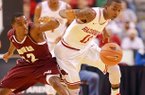 Arkansas Democrat-Gazette/STEPHEN B. THORNTON -- Alabama A&M's Green Hill, left, and Arkansas' BJ Young battle for a loose ball after Young stripped it during the first half of their game Saturday night at Verizon Arena in North Little Rock.