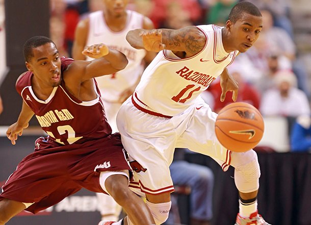 arkansas-democrat-gazettestephen-b-thornton-alabama-ams-green-hill-left-and-arkansas-bj-young-battle-for-a-loose-ball-after-young-stripped-it-during-the-first-half-of-their-game-saturday-night-at-verizon-arena-in-north-little-rock