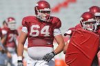 Arkansas center Travis Swanson, a three-year starter, would be the only returning Razorbacks' offensive lineman with All-SEC honors if he returns for his senior season.