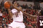 Arkansas' BJ Young drives to the basket  against Alabama A&M's Green Hill during the second half Saturday, Dec. 22, at Verizon Arena in North Little Rock. He finished with 13 points and a career-high 9 assists.