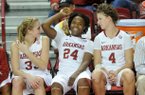 Arkansas players Melissa Wolf, Quistelle Williams and Sarah Watkins relax on the bench for the final minutes of their 80-41 win over Northwestern State on Friday, Dec. 21, at bud Walton Arena in Fayetteville.