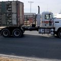 A truck enters the Tyson Foods Berry Street plant Tuesday in Springdale. The recession created chall...