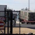 A truck drives onto scales Tuesday at the Tyson Foods Berry Street plant in Springdale. While factor...