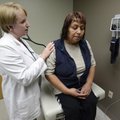 Jennifer Jennings, nurse practitioner, checks Sophia Sanchez’s breathing Thursday while giving the R...