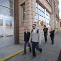 Pedestrians walk past the entrance to The Dickson, a development on West Dickson Street in Fayettevi...