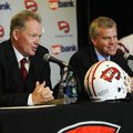 New Western Kentucky head coach Bobby Petrino, left, responds to a question as athletic director Tod...
