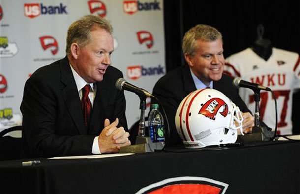 new-western-kentucky-head-coach-bobby-petrino-left-responds-to-a-question-as-athletic-director-todd-stewart-smiles-during-an-ncaa-college-football-news-conference-monday-dec-10-2012-in-bowling-green-ky-the-51-year-old-was-fired-by-arkansas-in-april-for-a-pattern-of-misleading-behavior-following-an-accident-in-which-the-coach-was-injured-while-riding-a-motorcycle-with-his-mistress-as-a-passenger-but-now-wants-to-make-the-most-of-his-second-chance-ap-photothe-daily-news-joe-imel