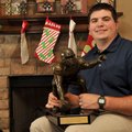 Jonathan Luigs, former University of Arkansas football player, won the Rimington Trophy as a Razorba...