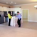 David Wilson, a Realtor with Weichert Realtors, waits as Connie Burklow inputs her information on an...