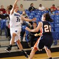 McKinzie James, left, Rogers High, passes the ball over Rogers Heritage’s Gina Britton during the Gr...