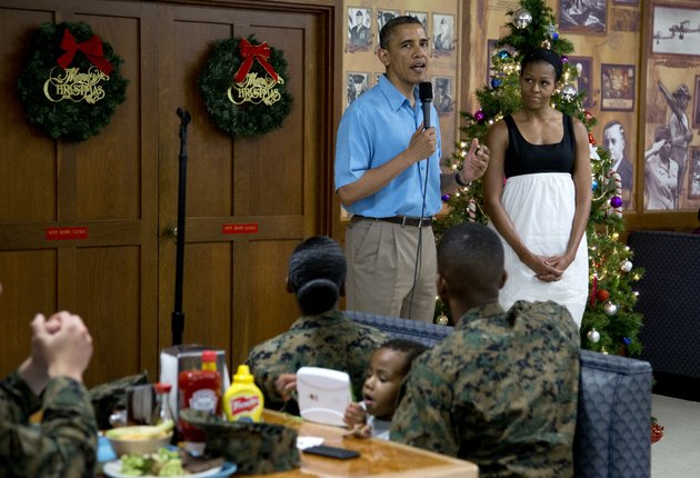 president-barack-obama-speaks-as-first-lady-michelle-obama-listens-during-a-visit-with-members-of-the-military-and-their-families-in-anderson-hall-at-marine-corp-base-hawaii-on-tuesday-dec-25-2012-in-kaneohe-bay-hawaii-the-first-family-is-in-hawaii-for-a-holiday-vacation