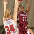 Springdale’s Jayvonda Daniels, right, shoots the ball over Seneca (Mo.) defender Elena Wood during W...