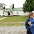 Illinois Chapel Baptist Church members Della McKee, right, and Patricia Clark embrace Friday, April ...