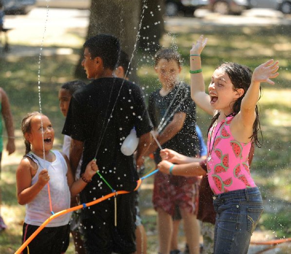 Lehua Leonard, 10, right, laughs ...