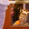 Carter Johnson, 17 months, of Fayetteville presses his face against the glass of a door Saturday, Oc...