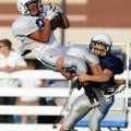 Springdale Har-Ber receiver Miguel Salgado leaps for a catch as cornerback Ben Schaffer makes the ta...