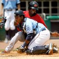 Frisco's Jurickson Profar is tagged out at home by Naturals catcher Julio Rodriguez during the first...