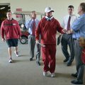 University of Arkansas coach Bobby Petrino heads into a press conference before practiceTuesday afte...