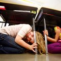 Happy Hollow Elementary third-graders Mittie Eiland, 8, and Stephanie Santos, 8, huddle under their ...