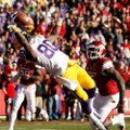 Louisiana State wide receiver Jarvis Landry makes a catch for a touchdown in front of Arkansas lineb...